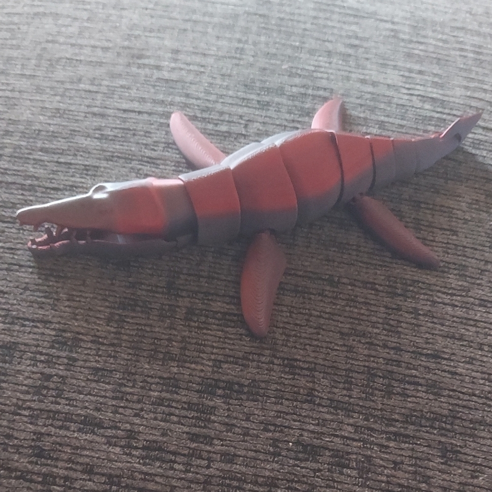 Red and Black Dinosaur Toy